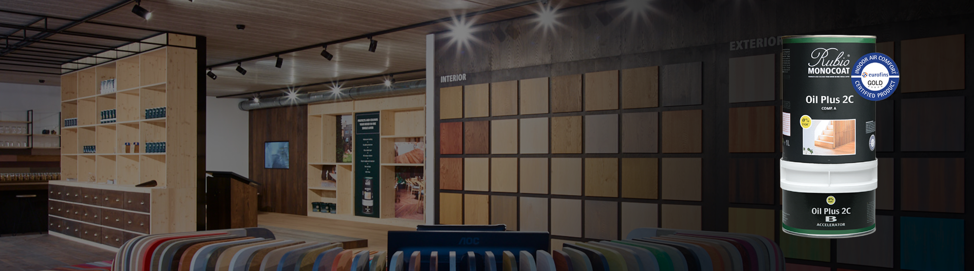 Display of paint swatches and a product container in a showroom setting